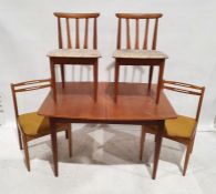 Mid century modern teak extending table by Elliotts of Newbury, on cylindrical tapering supports