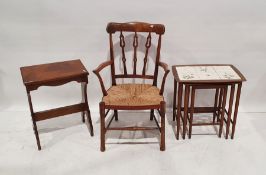 Continental armchair with shaped and pierced backsplats, rush-seated, on turned supports, a mid-