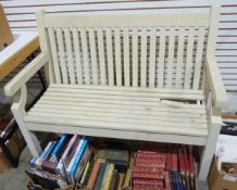 Two-seater cream-coloured garden bench