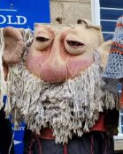 Oversized theatre prop head by Purves Puppets and a pair of moulded rubber hands. Provenance: