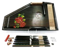 Musical instrument, labelled 'Auto Harps', with accessories