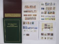 Bag and box of 100s of used stamps and Australian year books, from 1980's and 1990's plus three