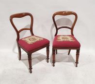 Set of four Victorian mahogany dining chairs with needlework upholstered seats, turned front legs (