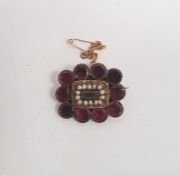 Late Georgian garnet and seedpearl memorial brooch, rectangular with seedpearls, having a surround