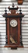 Small Vienna regulator-type clock in carved decorated case, the white enamel dial with Arabic