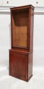 Early 20th century oak bookcase cabinet with adjustable shelves above the single door cupboard