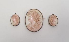 Carved pale pink shell cameo brooch, oval, female bacchanalian profile and pair smaller pendants (3)