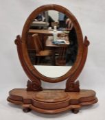 Oval toilet mirror on shaped platform base