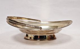 George III silver swing-handled cake basket of navette form, armorial to the centre, William Allen
