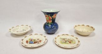 Early 20th century Royal Doulton pottery vase, floral decorated to a blue ground, bulbous with