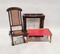 Early 20th century oak umbrella/stickstand on plinth base, a 'Guest' bed tray and a folding cane