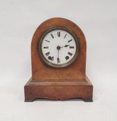 Walnut veneered mantel clock in arch case, on bracket feet, Roman numerals on white enamelled