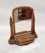 19th century walnut dressing table mirror with arched top, on column supports, platform base with