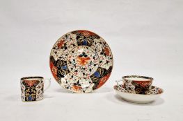 Early 19th century Derby imari pattern trio, viz:- coffee cup, teacup and saucer, and matching