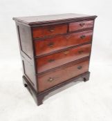 Early Georgian walnut chest of two short over three long drawers, the rectangular top with moulded