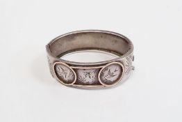 Victorian silver-coloured metal bangle, engraved with birds and diaperwork