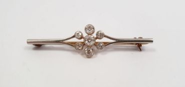 Platinum and seven-stone diamond cluster bar brooch, centre diamond approx. 0.25ct  flanked by two