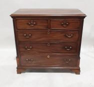 Georgian mahogany chest of two short over three long drawers, the rectangular top with applied