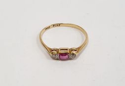 18ct gold, ruby and diamond ring set centre baguette-cut ruby flanked by pair collet-set small
