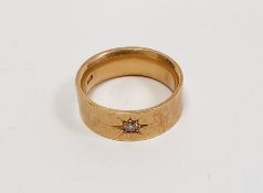 18ct gold ring set with solitaire diamond, in star engraved setting, diamond 3mm diameter approx.,