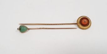 Gold and coral stickpin set single coral within circular surround and fine ropetwist border and a