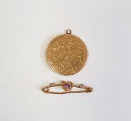 9ct gold locket pendant, circular and foliate scroll engraved, 4g and a gold-coloured, amethyst
