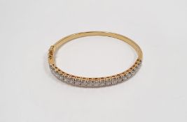 18ct gold bangle set with 20 diamonds, stamped 750, approx. 15g  Condition ReportInside diameter