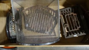 Assorted fire grates and a stainless steel spark guard