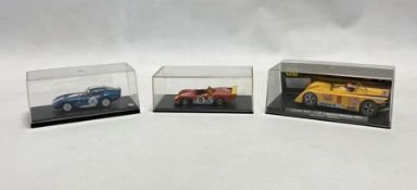 Three cased diecast model cars to include Kyosho Cobra Daytona Coupe #26, Red Line Models RL022