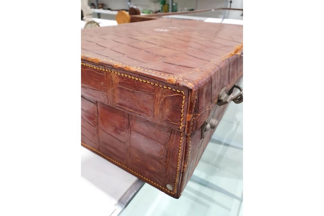 A crocodile skin suitcase, early to mid 20th century, gilt lettering stamped for John Bagshaw & - Image 13 of 36