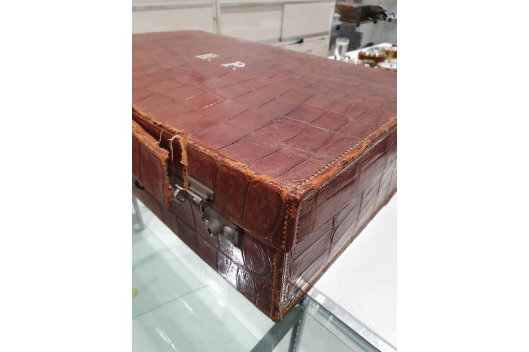 A crocodile skin suitcase, early to mid 20th century, gilt lettering stamped for John Bagshaw & - Image 10 of 36