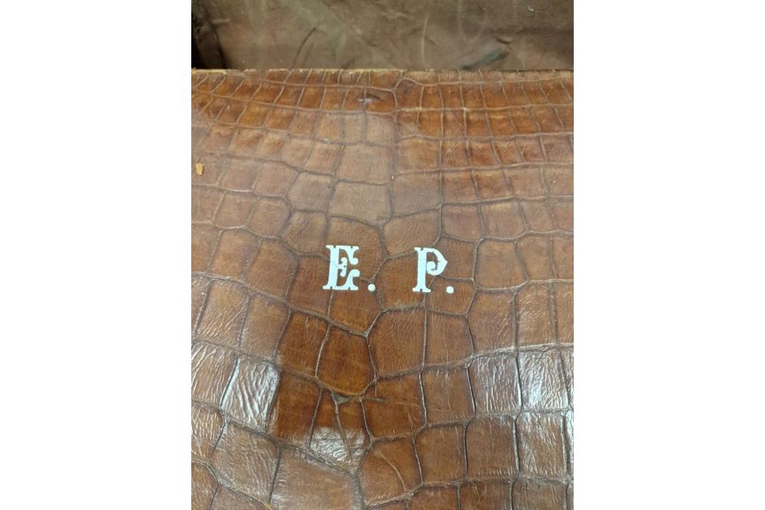A crocodile skin suitcase, early to mid 20th century, gilt lettering stamped for John Bagshaw & - Image 2 of 36