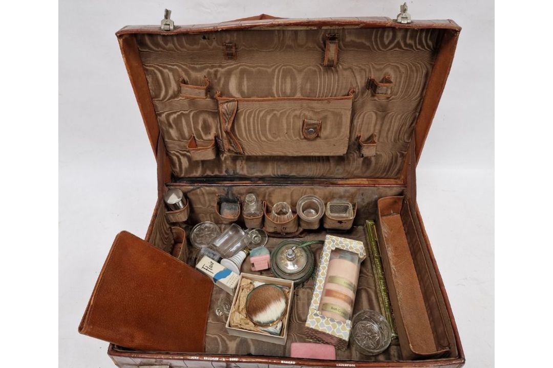 A crocodile skin suitcase, early to mid 20th century, gilt lettering stamped for John Bagshaw & - Image 5 of 36