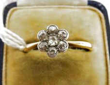 Gold and diamond flowerhead cluster ring set seven small stones, in case