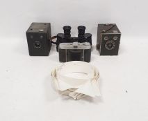 Assortment of vintage cameras and binoculars to include a Retina by Kodak camera, a box camera,
