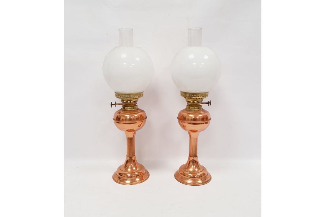 Pair of copper and brass oil lamps, marked Duplex made in England, with their accompanying chimney - Image 1 of 2