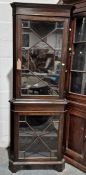 20th century corner display cabinet, the moulded cornice above astragal-glazed door enclosing