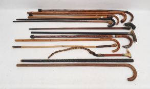 Quantity of assorted walking sticks to include a child's hunting crop with the horn handle formed as