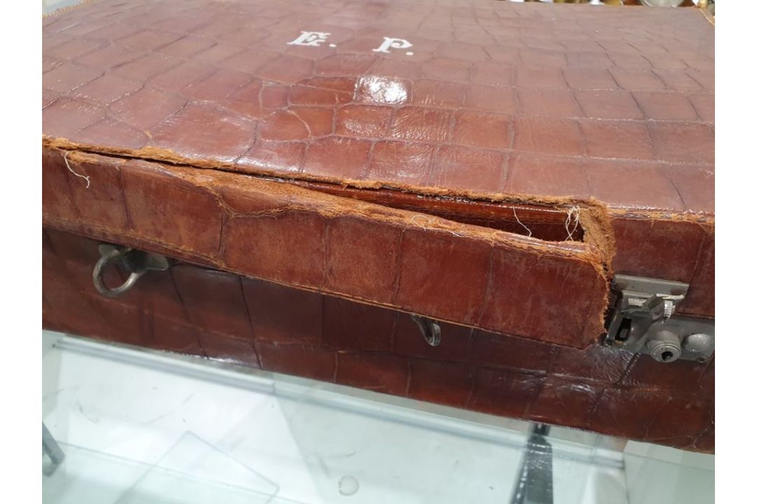A crocodile skin suitcase, early to mid 20th century, gilt lettering stamped for John Bagshaw & - Image 9 of 36