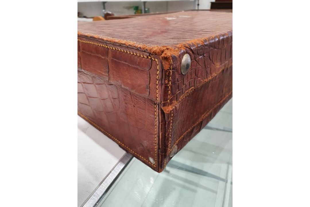 A crocodile skin suitcase, early to mid 20th century, gilt lettering stamped for John Bagshaw & - Image 18 of 36