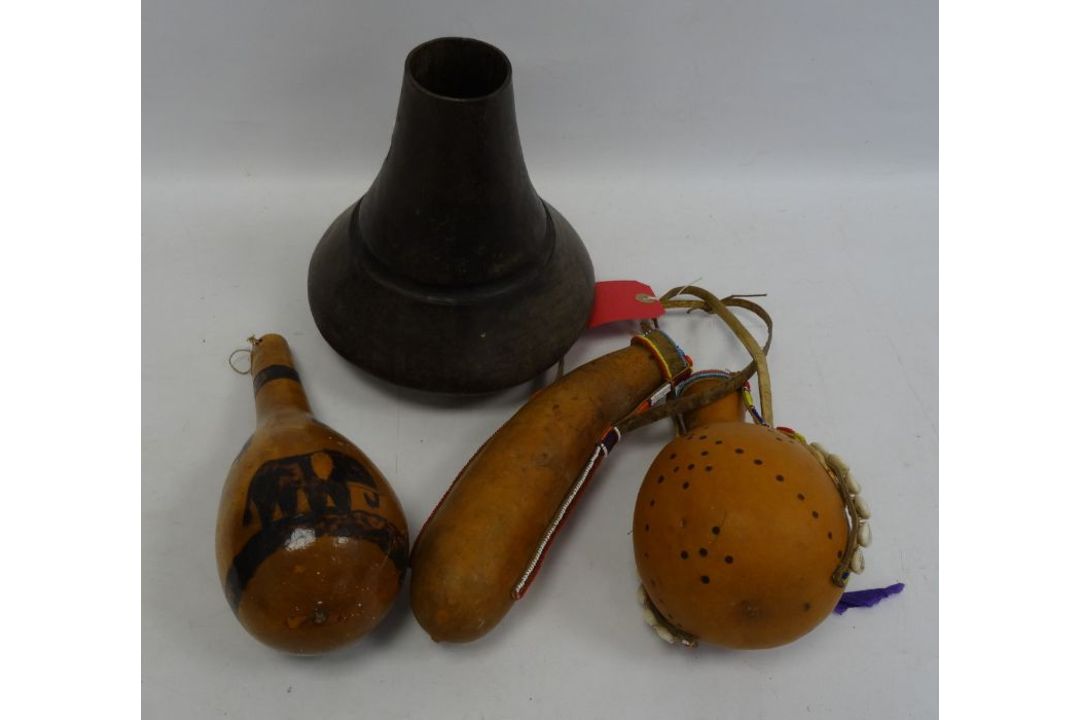 Three African gourd water pots, one featuring a painetd savannah scene, the other decorated with dot