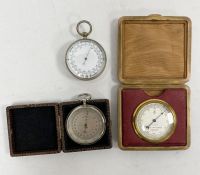 Three pocket barometers including a German aneroid barometer in chrome case 5cm diam., a desk