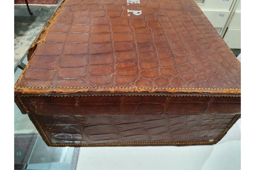 A crocodile skin suitcase, early to mid 20th century, gilt lettering stamped for John Bagshaw & - Image 12 of 36