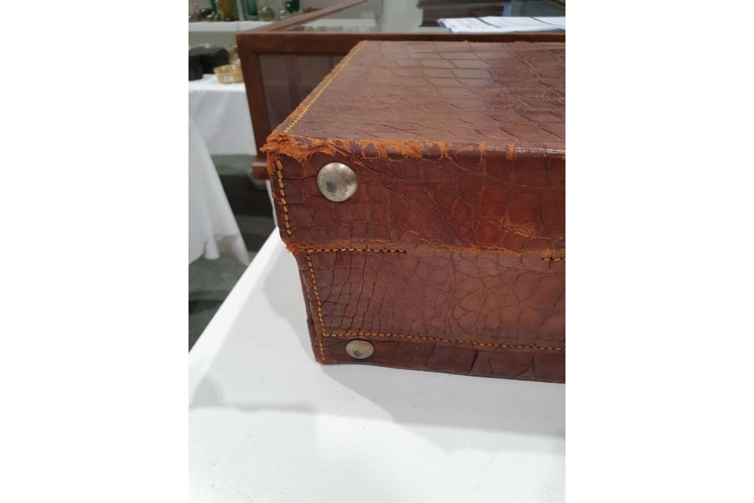 A crocodile skin suitcase, early to mid 20th century, gilt lettering stamped for John Bagshaw & - Image 17 of 36