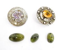 Scottish silver and amethyst brooch set single cut stone and a similar Celtic-pattern brooch set cut