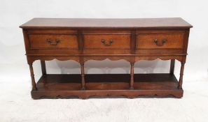 Modern oak three-drawer sideboard in the 18th century manner, the rectangular top with moulded