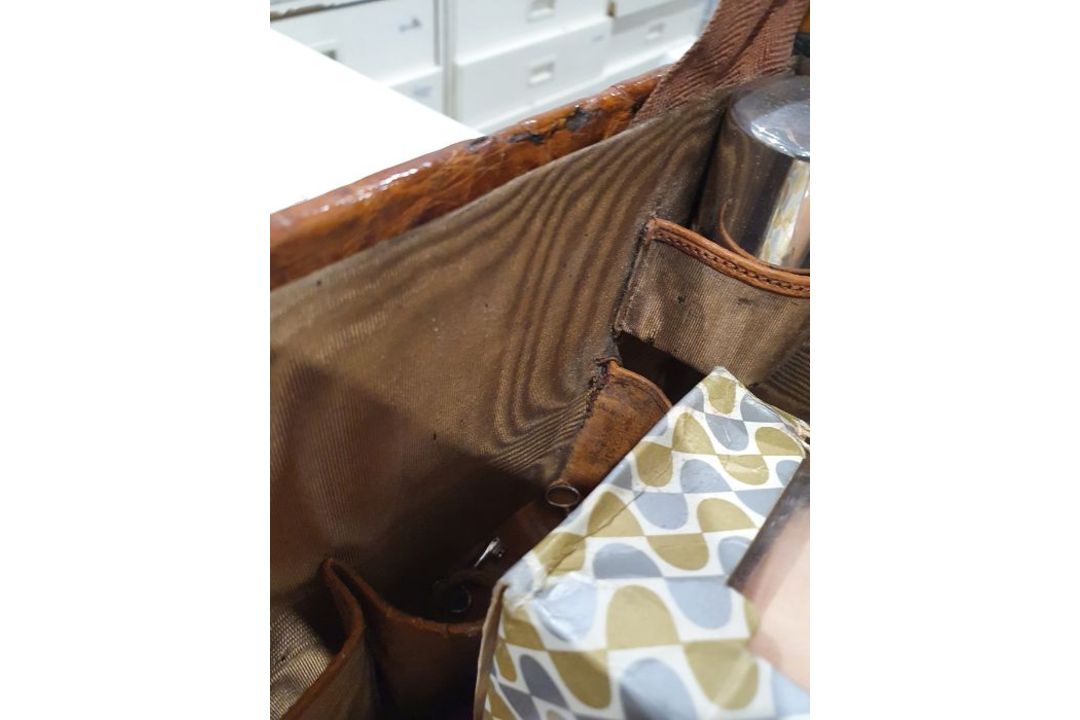 A crocodile skin suitcase, early to mid 20th century, gilt lettering stamped for John Bagshaw & - Image 27 of 36