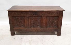 Possibly 17th century and later oak coffer, the rectangular top with moulded front edge, above three