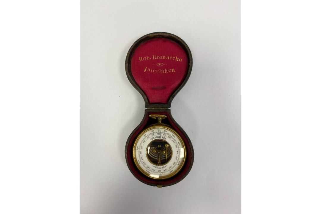 Brass-cased open-faced German skeleton pocket barometer,  the white dial named V.REG VERAND BETG,