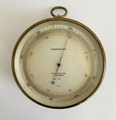 Early 20th century brass cased compensated barometer by T. Wheeler (London), the silvered dial